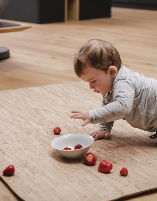 Large play mat made of lined cork cream-colored