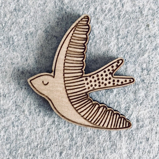 Pin with wooden swallow